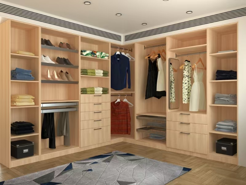 Walk-in closet system with shelving, hanging storage, drawers, and glass doors
