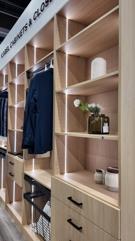 Luxury walnut walk-in closet with integrated lighting and drawer storage