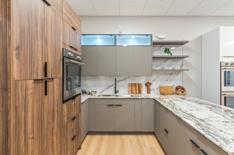 Frameless kitchen with walnut cabinets and matte neutral doors